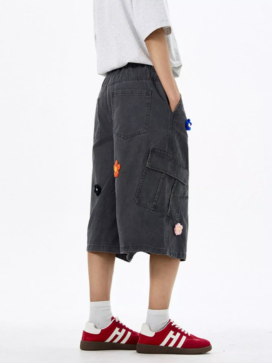 Dark Gray cotton cargo shorts with floral appliques and wide legs.