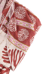 Charming floral tie-front romper in red with white and pink abstract print.