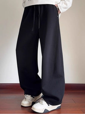 Men's black drawstring wide-leg sweatpants with a comfortable casual fit.