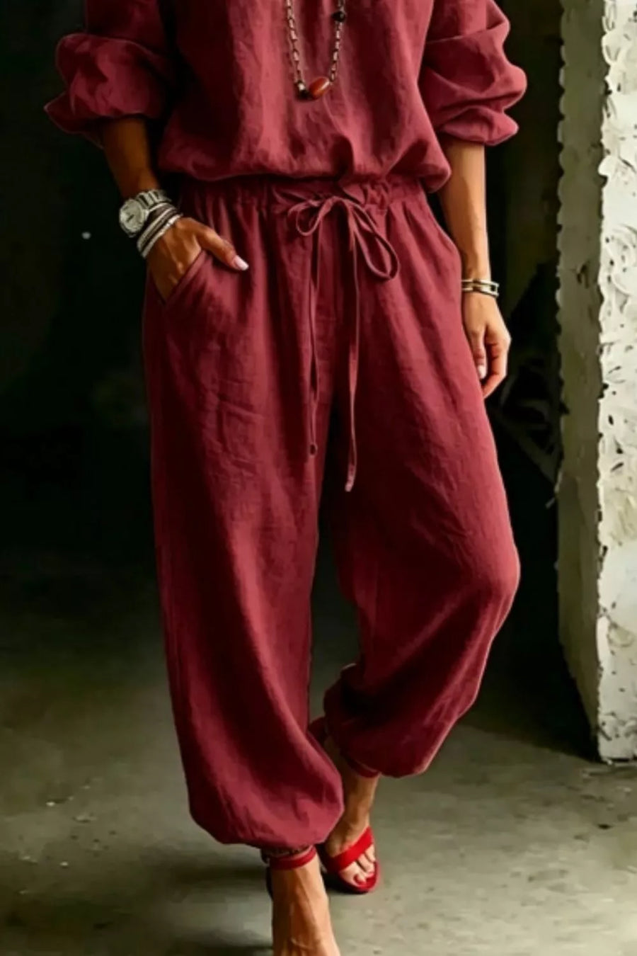 Burgundy cotton drawstring pants with pockets, part of an off-shoulder set.