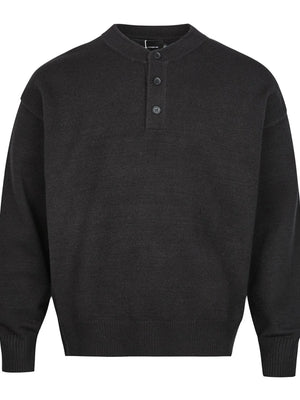 Black button detail drop shoulder sweater with a band collar.