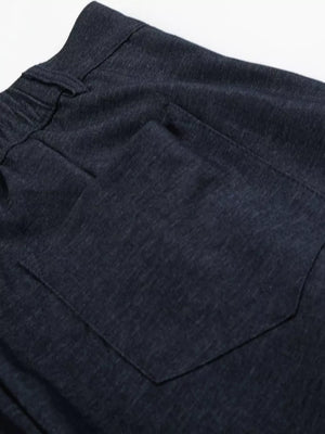 Relaxed fit sweatpants in dark heathered cationic fabric with a back pocket.