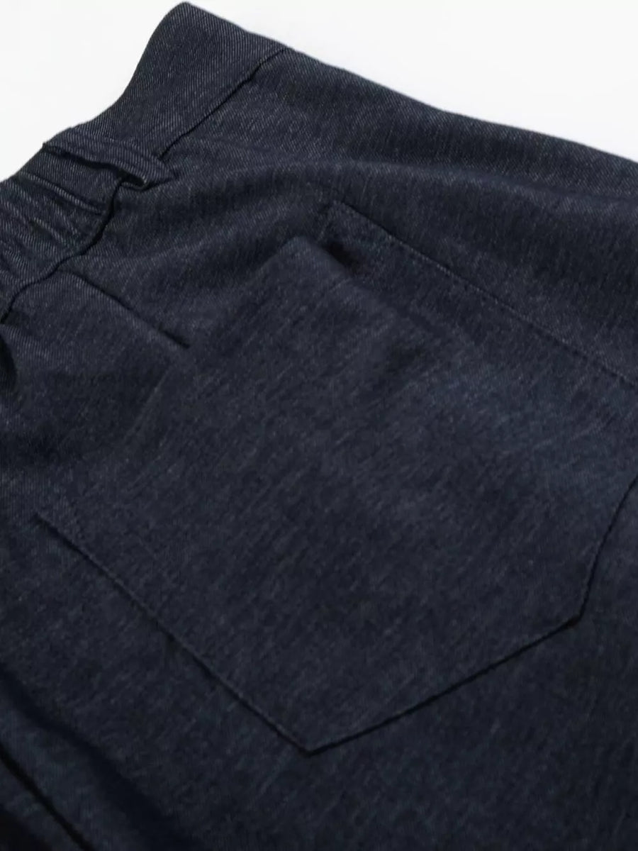 Relaxed fit sweatpants in dark heathered cationic fabric with a back pocket.
