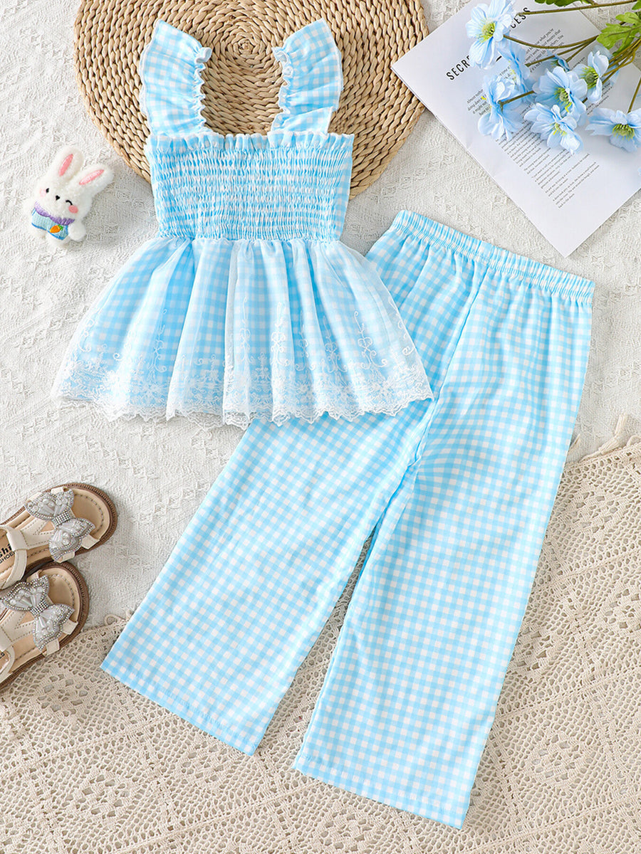 Blue gingham baby set with smocked top, ruffled straps, lace trim, and matching pants.