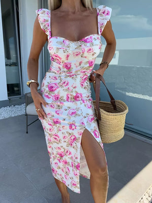 Floral sweetheart midi dress with slit and ruffled sleeves.