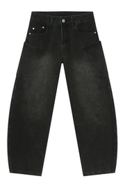Black denim baggy trousers with unique paneling and cargo pockets.