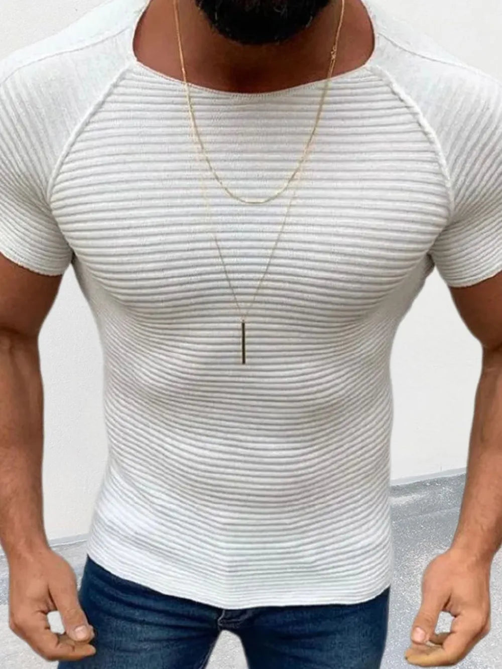 Ivory ribbed raglan tee with a sculptural fit and short sleeves.