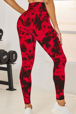 Ink blot pattern high-waist leggings in deep red with black abstract print.