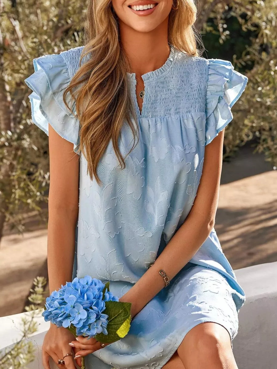 Sky blue floral embossed mini dress with smocked bodice and ruffled sleeves.