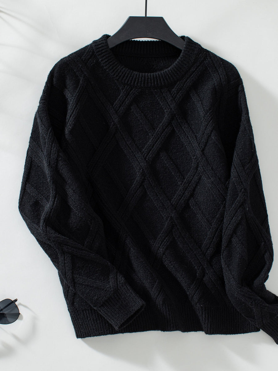 Black diamond cable knit crewneck sweater with ribbed cuffs and hem.