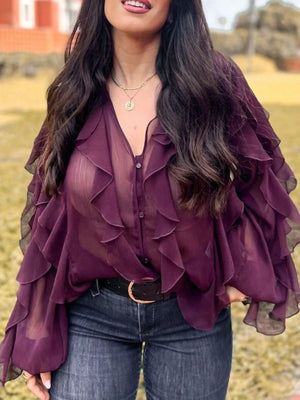 Burgundy sheer long-sleeve blouse with cascading ruffles and button front.
