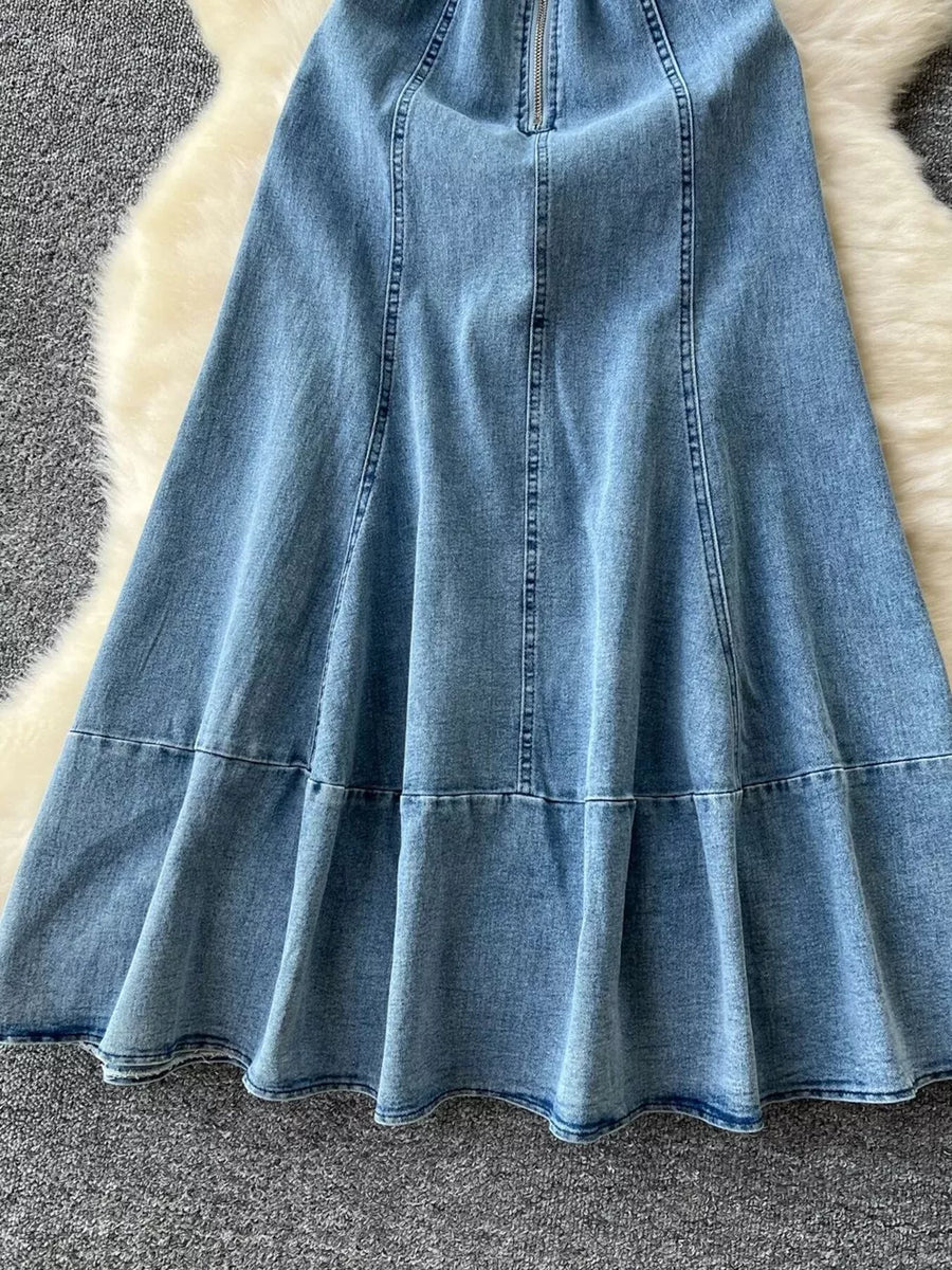 Blue denim A-line dress with zipper detail and tiered hem