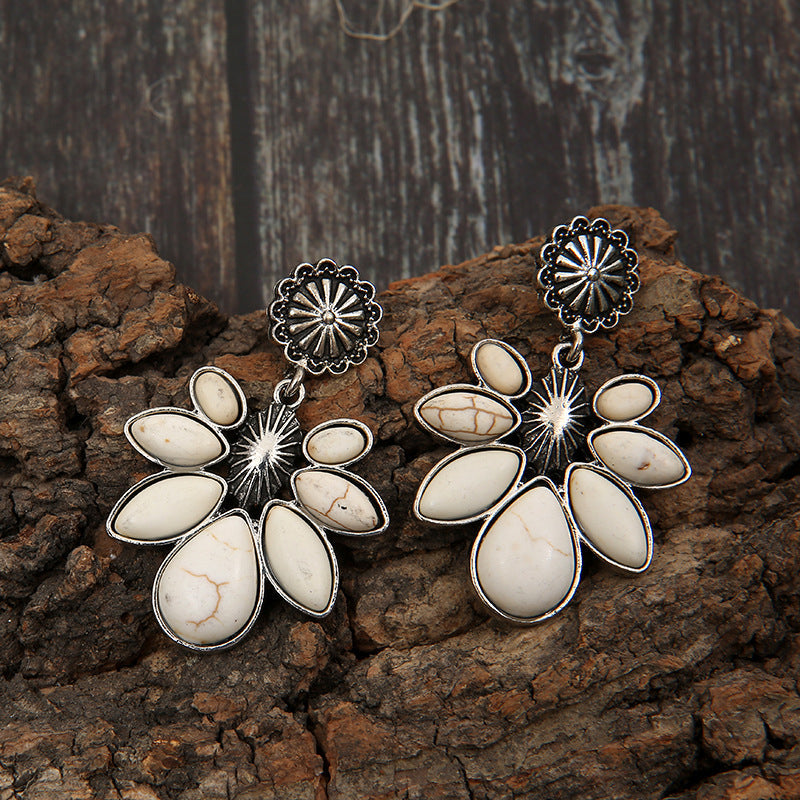 Floral white petal drop earrings with silver alloy metal and natural stone accents.