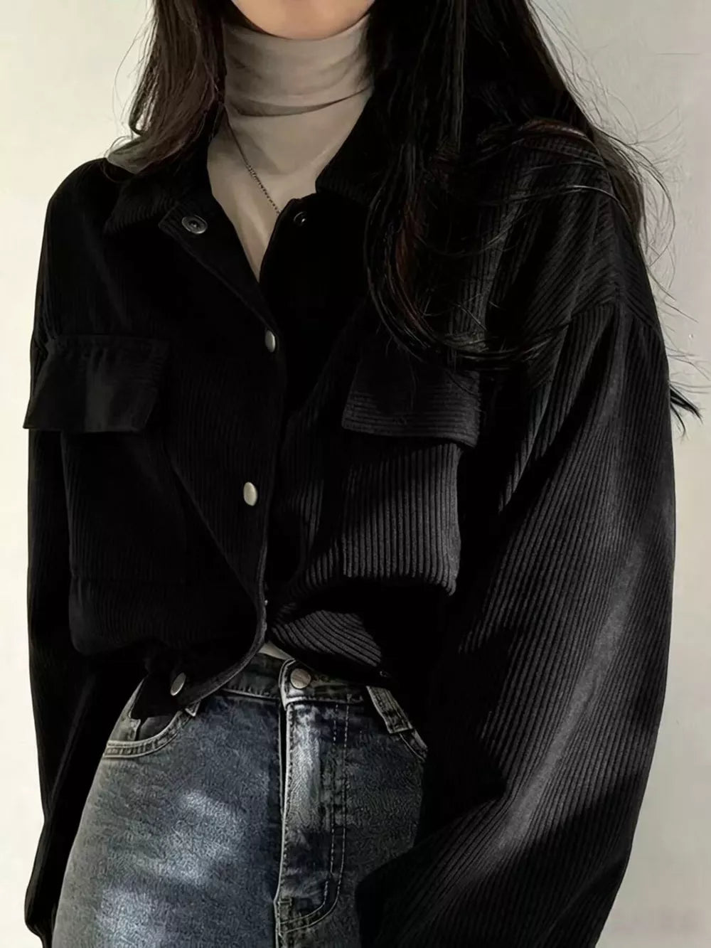 100% polyester Care instructions: Machine wash cold trucker jacket in Black with relaxed silhouette