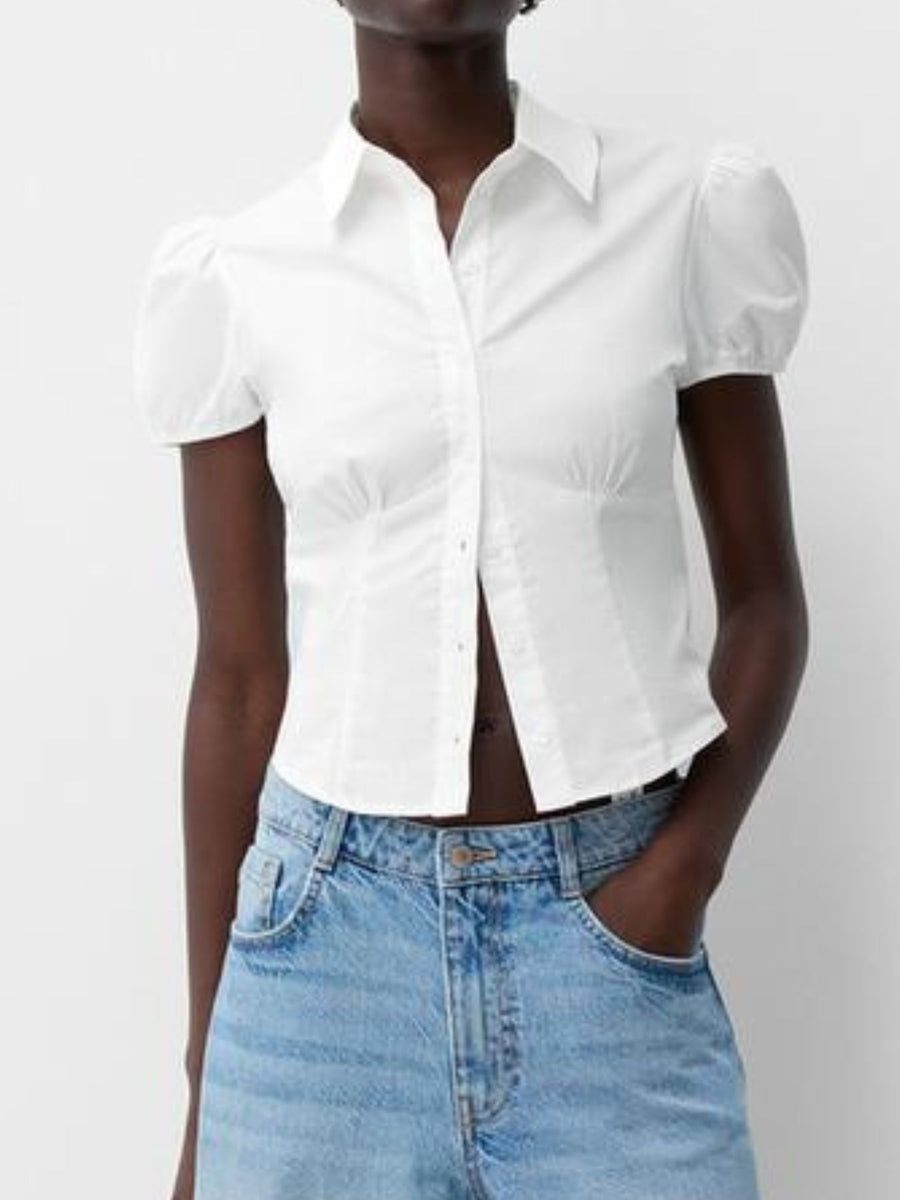 White puff sleeve fitted button-up shirt with a collared neckline.