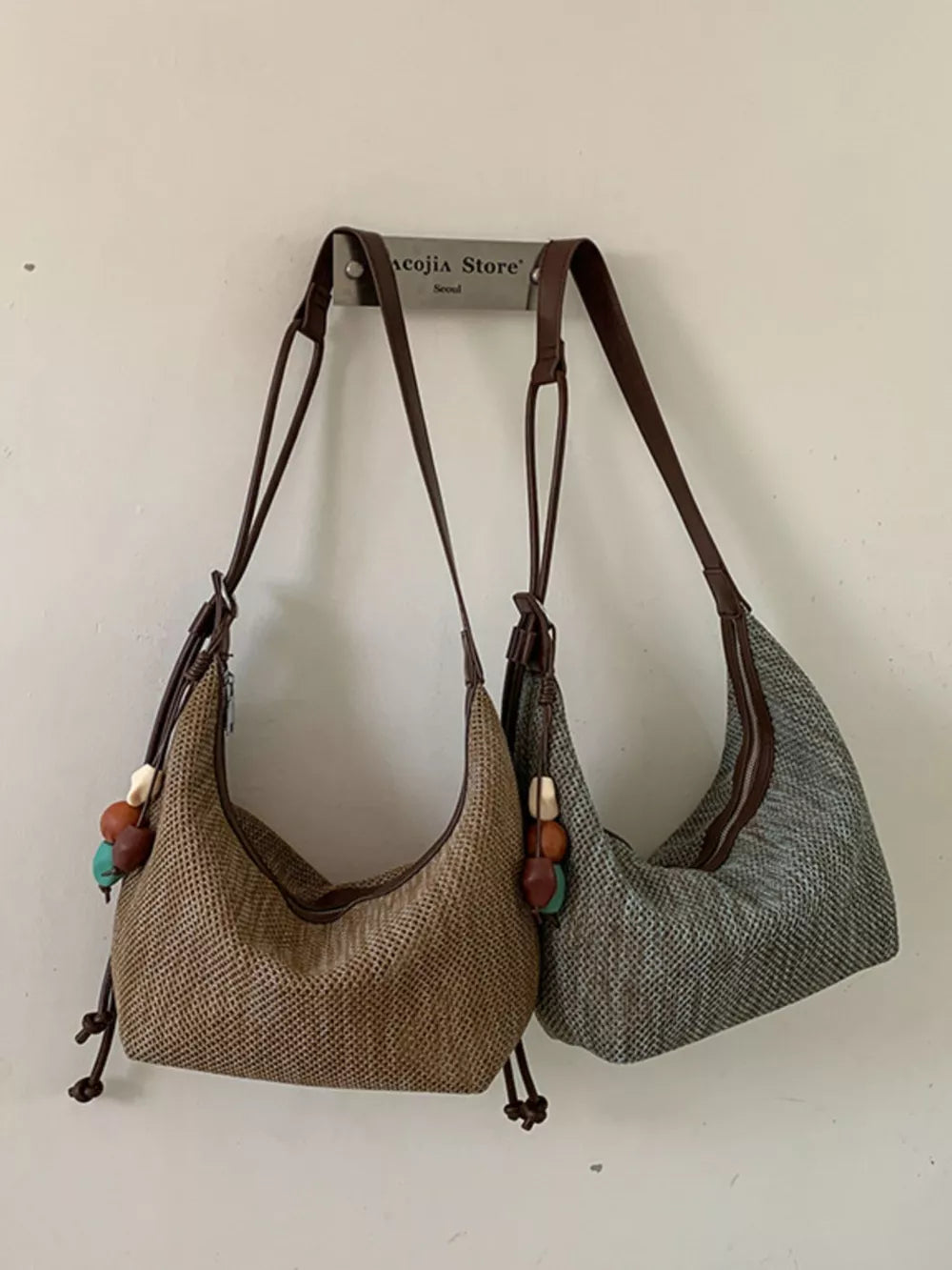 handbag in tan featuring adjustable straps and relaxed fit