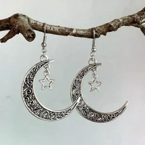 Filigree crescent moon drop earrings with star charms in Moon color.