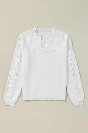 White sweater with floral embroidery and textured sleeves