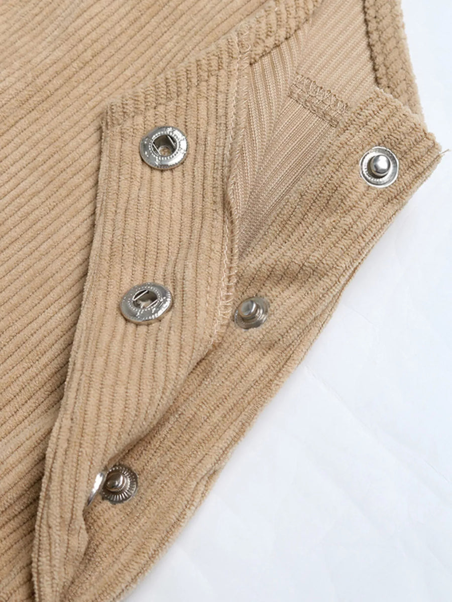 Tan corduroy overall dress detail showing snap closures