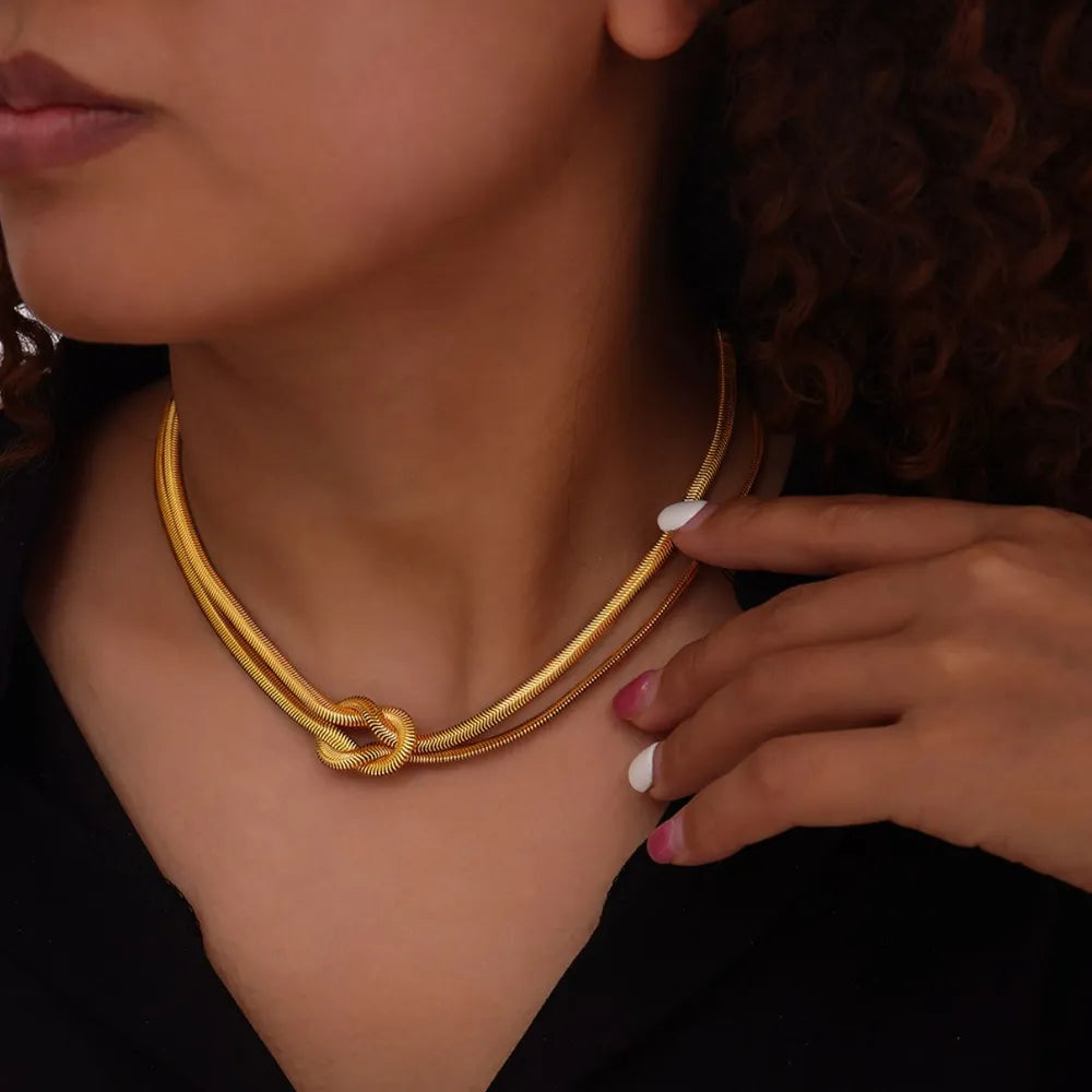 Gold knot detail serpent necklace with double snake chains