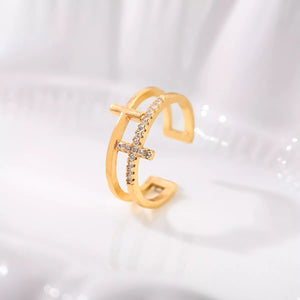 Golden open ring with rhinestone cross detail, 18K gold-plated.