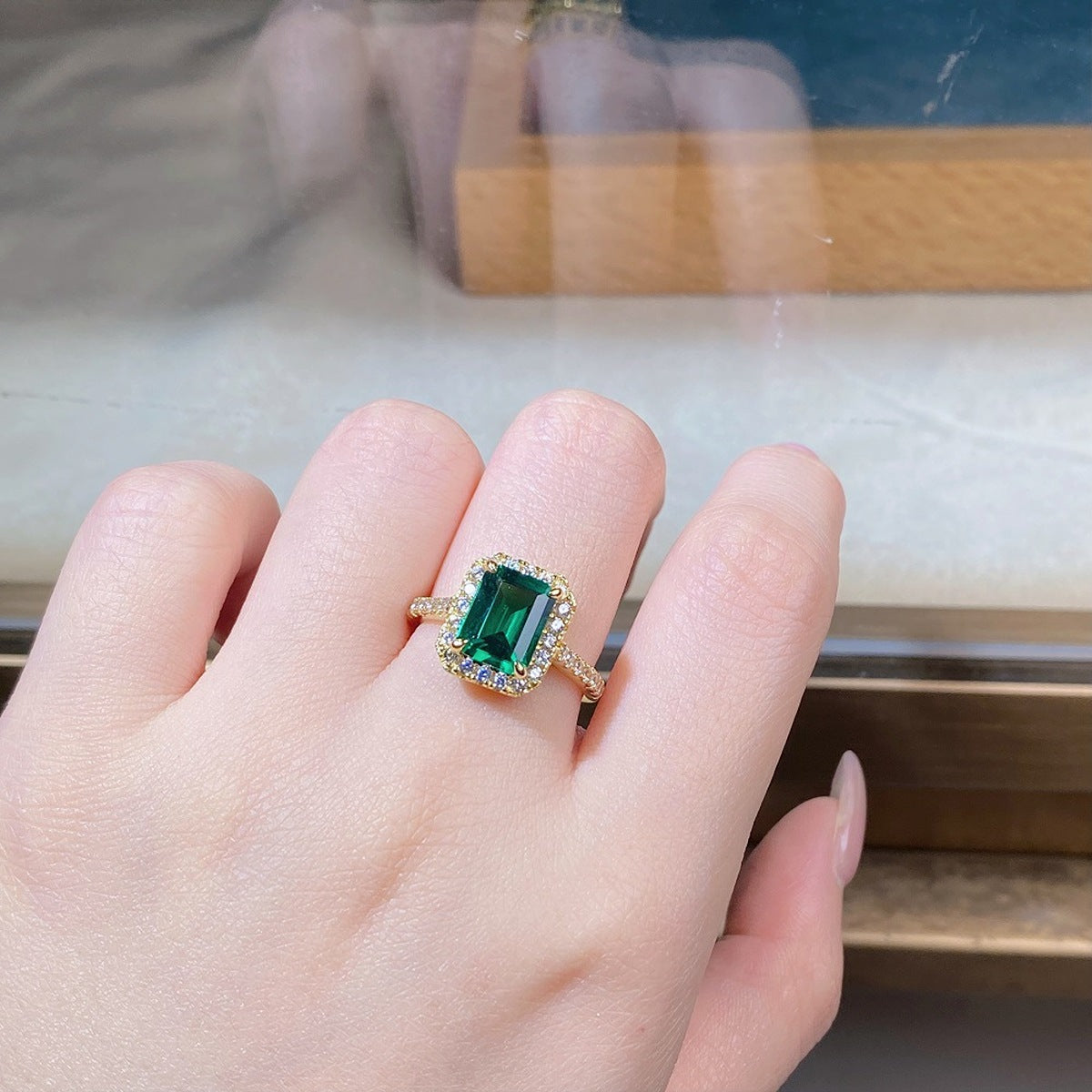 gold ring featuring geometric stone and geometric