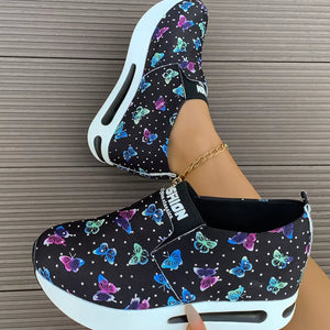 Butterfly print slip-on flats with air cushion and chunky sole.