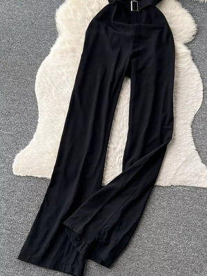 Black strapless wide-leg jumpsuit with a belted waist and feather trim detail.