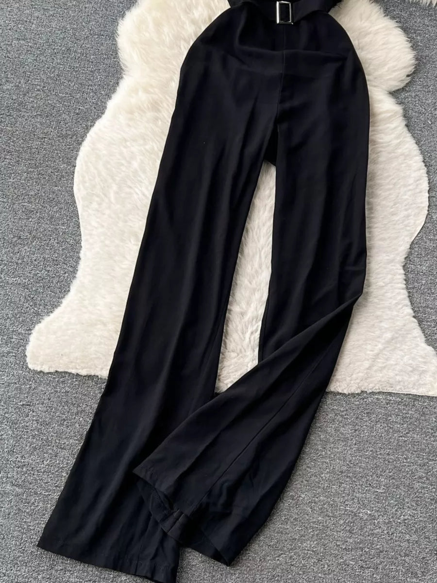 Black strapless wide-leg jumpsuit with a belted waist and feather trim detail.