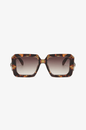Geometric facet sunglasses in tortoise shell with embellished temples and gradient brown lenses.