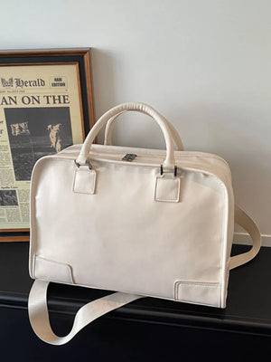Cream pu leather travel bag with top handles and adjustable strap