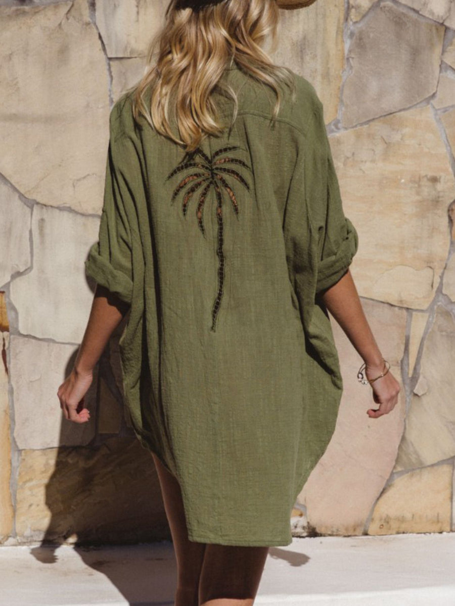 Green cotton blend button-down shirt dress with embroidered palm tree detail on back.