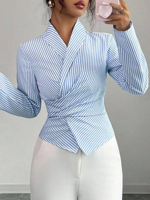 Striped long sleeve wrap blouse with a V-neck and cinched waist detail.