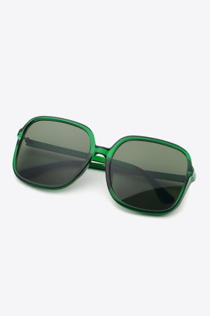 Green square frame sunglasses with dark lenses and bold acetate frames.