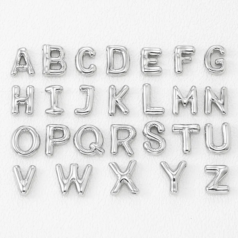 Silver letter pendant charms in all alphabet styles, made of copper.