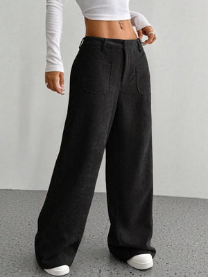Black corduroy wide-leg trousers with front pockets and a comfortable fit.