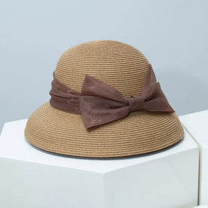 Straw sun hat in Khaki with a sheer brown bow detail.