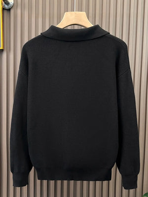 Black knitted sweater with classic collar and ribbed details