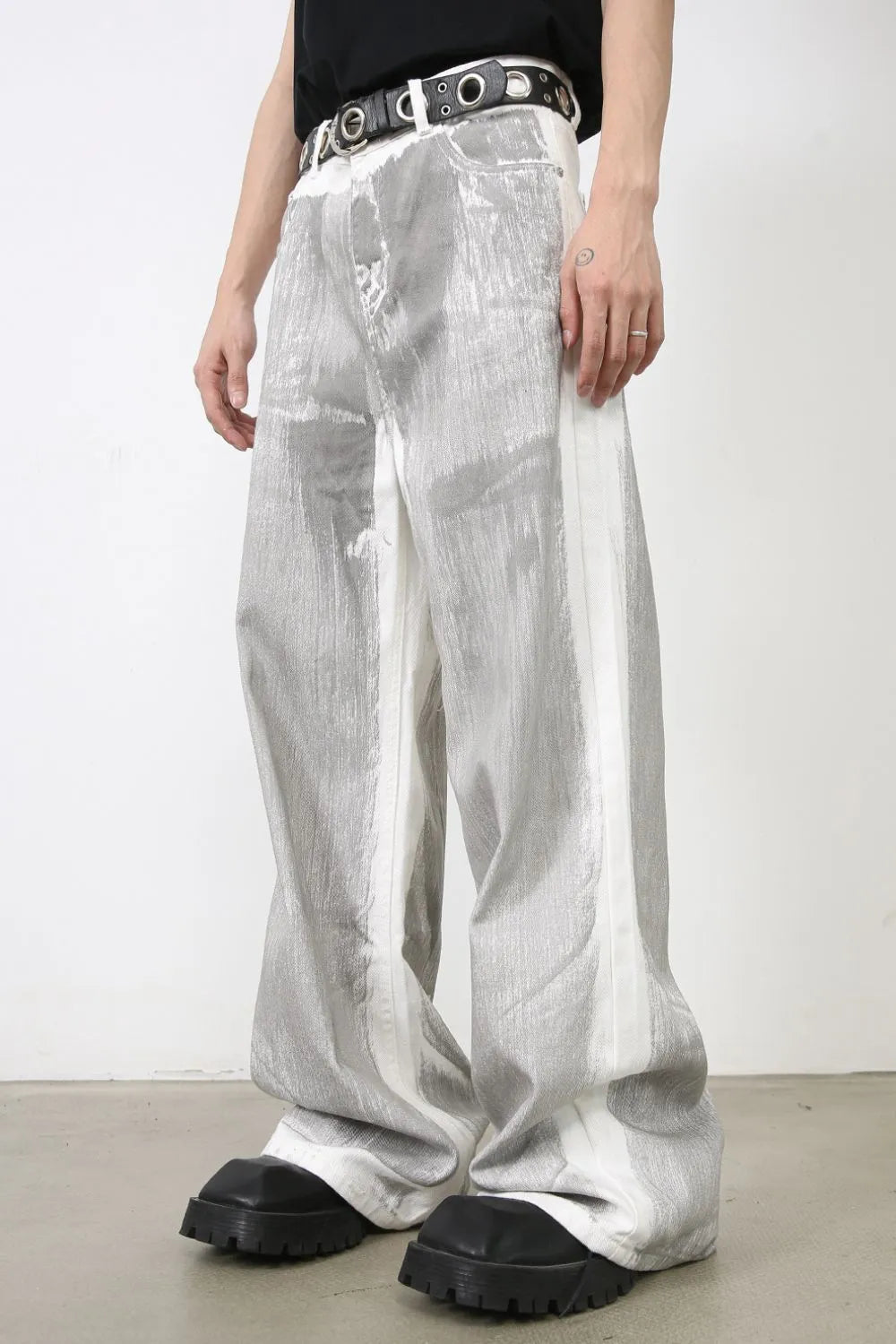 Metallic panel wide leg trousers in light with white side stripes and a brushed texture.