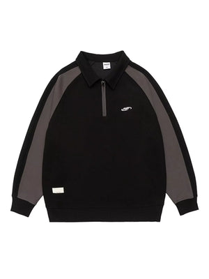 Black raglan quarter zip sweatshirt with contrast gray sleeves and embroidered logo