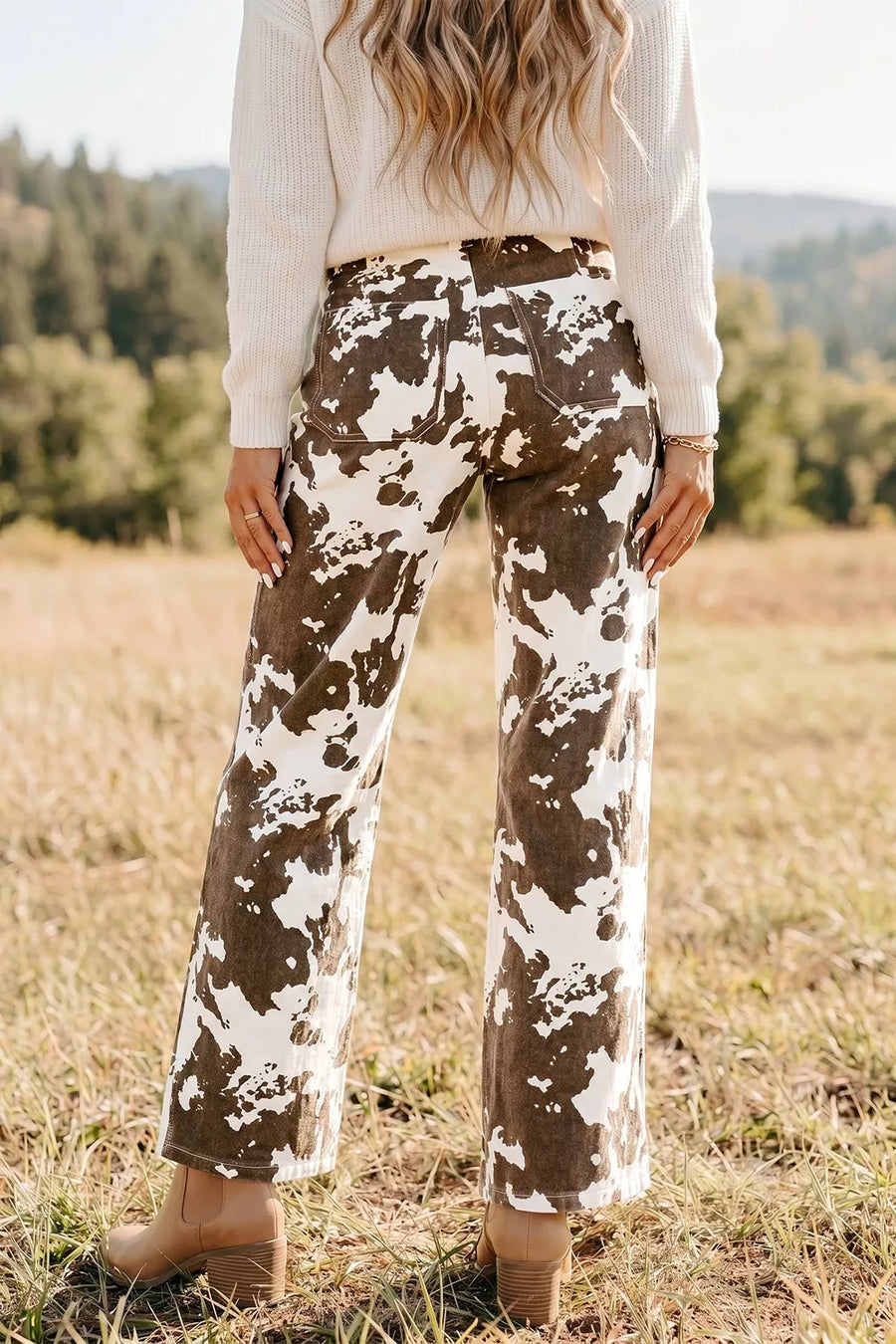 dark brown jeans featuring pocketed and abstract