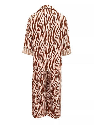 Brown zebra print relaxed fit loungewear set with collared top and wide leg pants.