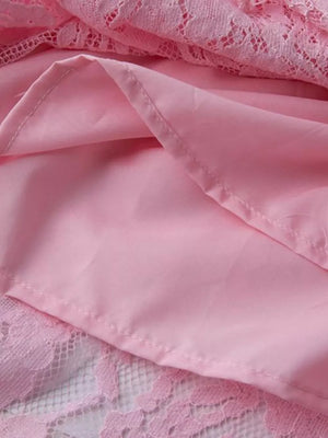 Pink lace midi dress with sheer sleeves and brocade detail