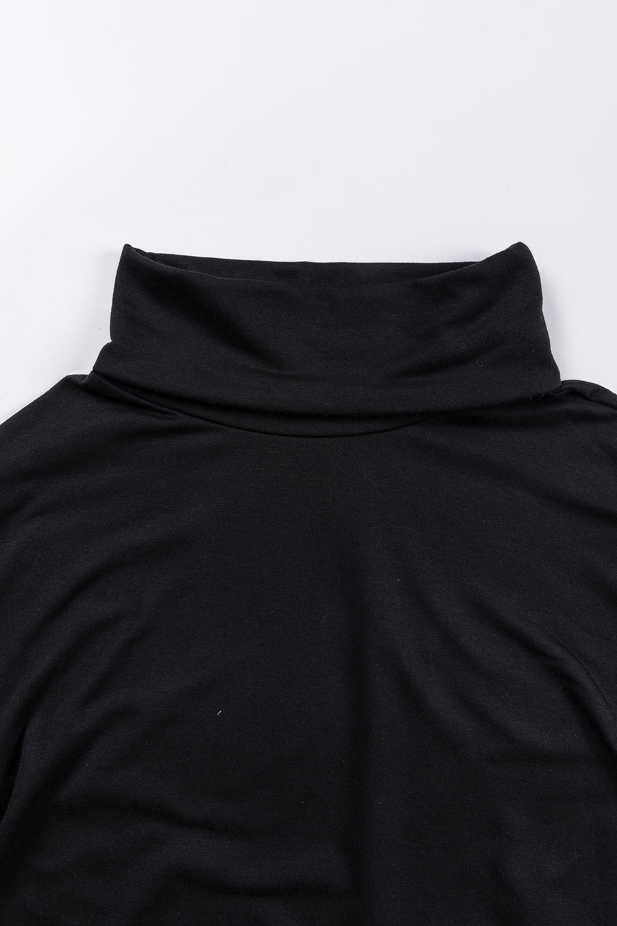 Black cowl neck tunic with draped front detail.