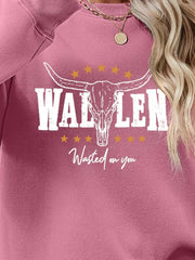 Blush Pink Western Graphic Sweatshirt with bull skull and stars graphic.