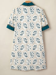 Floral print polo collar mini dress with teal trim and gold chain detail