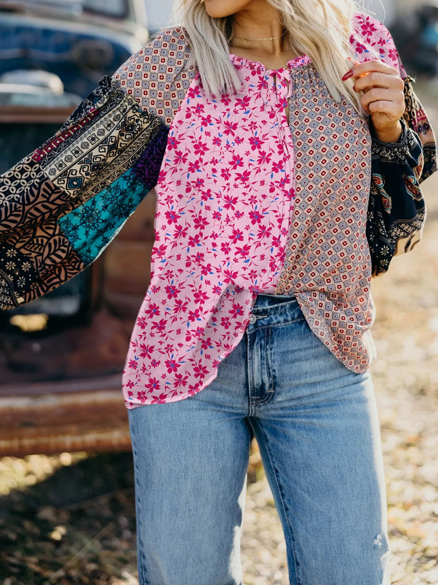 Boho floral drop shoulder blouse in fuchsia pink with patchwork print sleeves and tie neck.