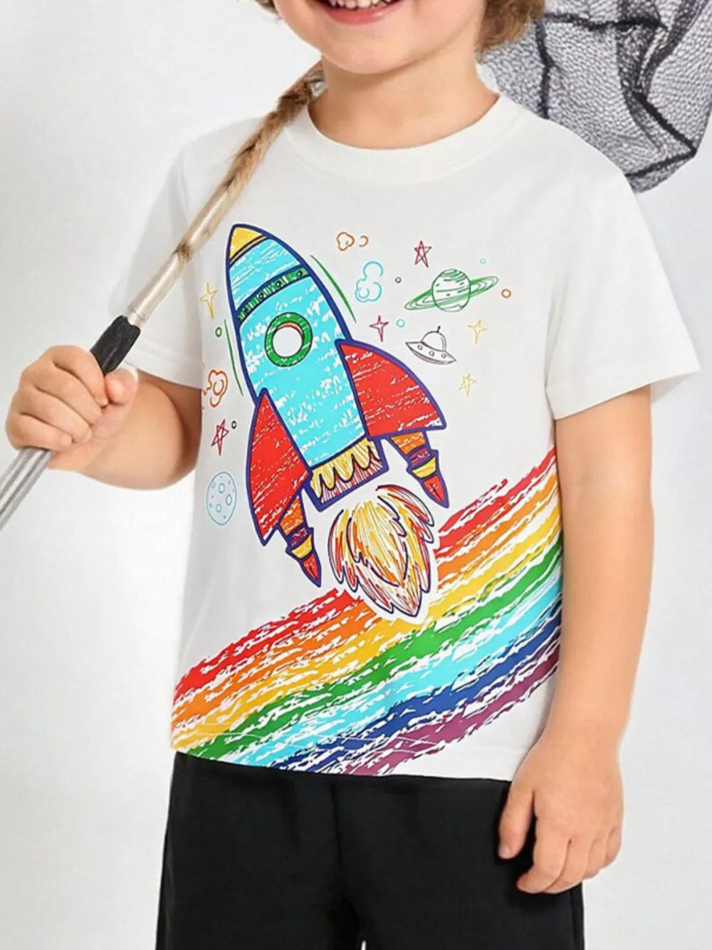 White cotton crew neck t-shirt with a rocket and rainbow graphic for kids.