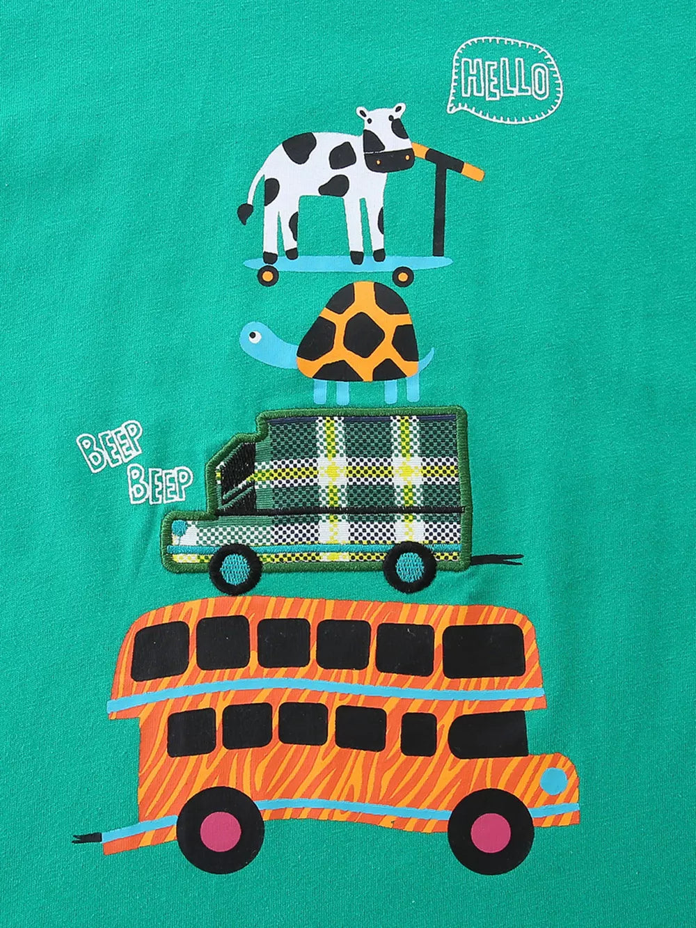 Green cotton toddler one-piece with stacked vehicle print: cow on scooter, turtle, plaid truck, orange bus.