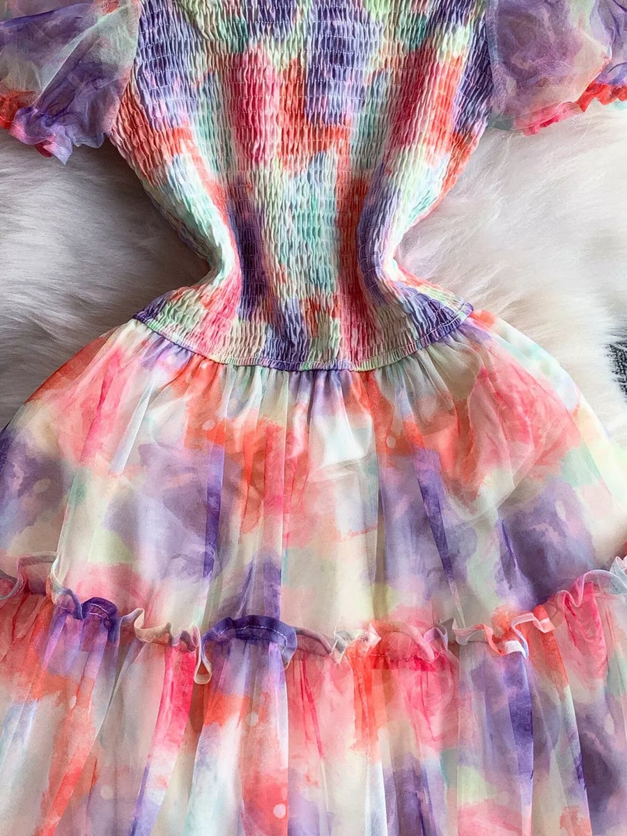 Floral tiered midi dress with smocked bodice in a sherbet tie-dye print.